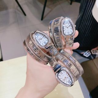 Đồng hồ nữ mặt bầu đính đá, dây kim loại dạng rắn 2 màu vàng - bạc Gossie Rắn