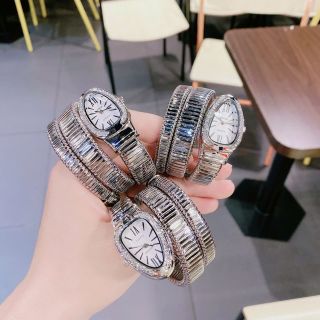 Đồng hồ nữ mặt bầu đính đá, dây kim loại dạng rắn 2 màu vàng - bạc Gossie Rắn