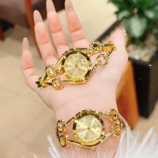 Đồng hồ nữ lắc tay mặt tròn, thiết kế mắt GU 3 màu trắng - vàng - vàng đen Gossie Lắc GU