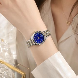 Đồng hồ nữ mặt tròn cọc đá, dây kim loại 2 màu xanh - bạc Gossie Kim Cương