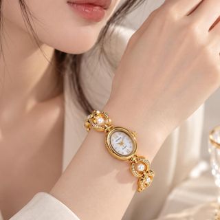 Đồng hồ nữ lắc tay phối ngọc 3 màu xanh - nâu - trắng Gossie Ngọc Bảo