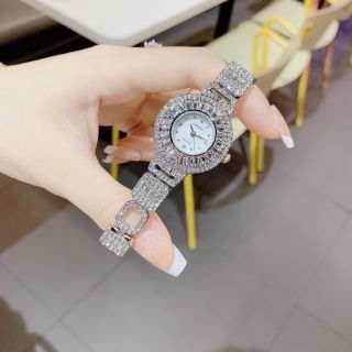 Đồng hồ nữ mặt tròn viền đá, dây kim loại 2 màu vàng - bạc Gossie Đá Vương Miện