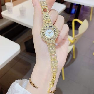 Đồng hồ nữ mặt tròn viền đá, dây kim loại 2 màu vàng - bạc Gossie Đá Vương Miện