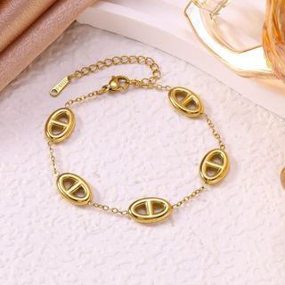 Vòng tay nữ thép titan mắt oval tone vàng sang trọng Vòng Tay Thép Titan Mũi Lợn