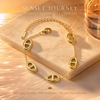 Vòng tay nữ thép titan mắt oval tone vàng sang trọng Vòng Tay Thép Titan Mũi Lợn