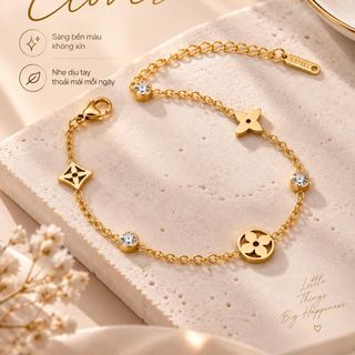 Vòng tay nữ thép titan họa tiết clover đính đá tone vàng thanh lịch Vòng Tay Thép Titan Clover