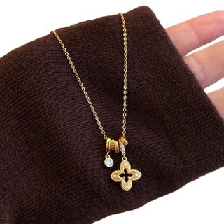 Dây chuyền nữ hoa cỏ bốn lá đính đá tone vàng sang trọng Dây Chuyền Zicor Hoa Cỏ Bốn Lá